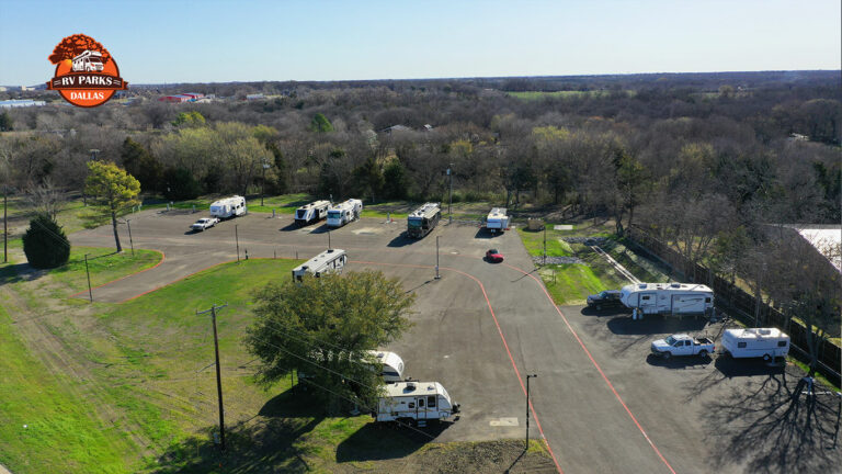 Aerial view of Dallas Melissa RV Park with RVs parked on paved sites and trees around the property